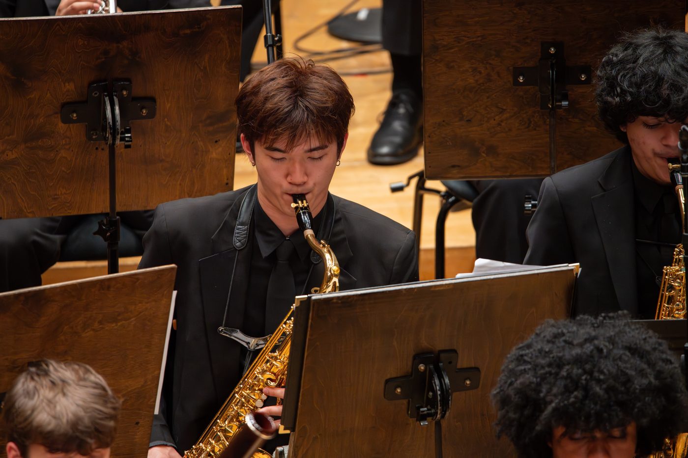 Ethan playing tenor saxophone with the AYWS at Symphony Center